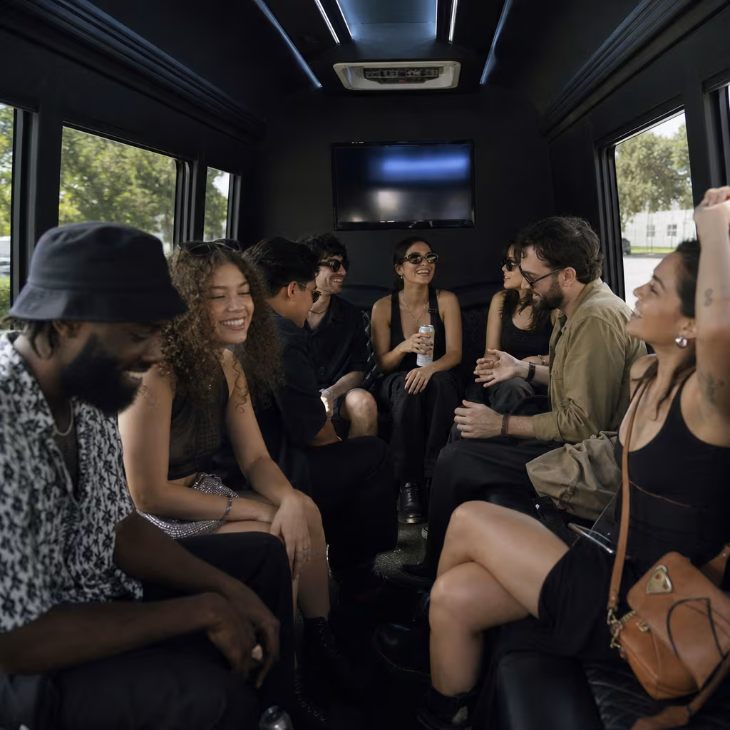 Group boarding a white charter bus for Concert Transportation transportation in Dallas