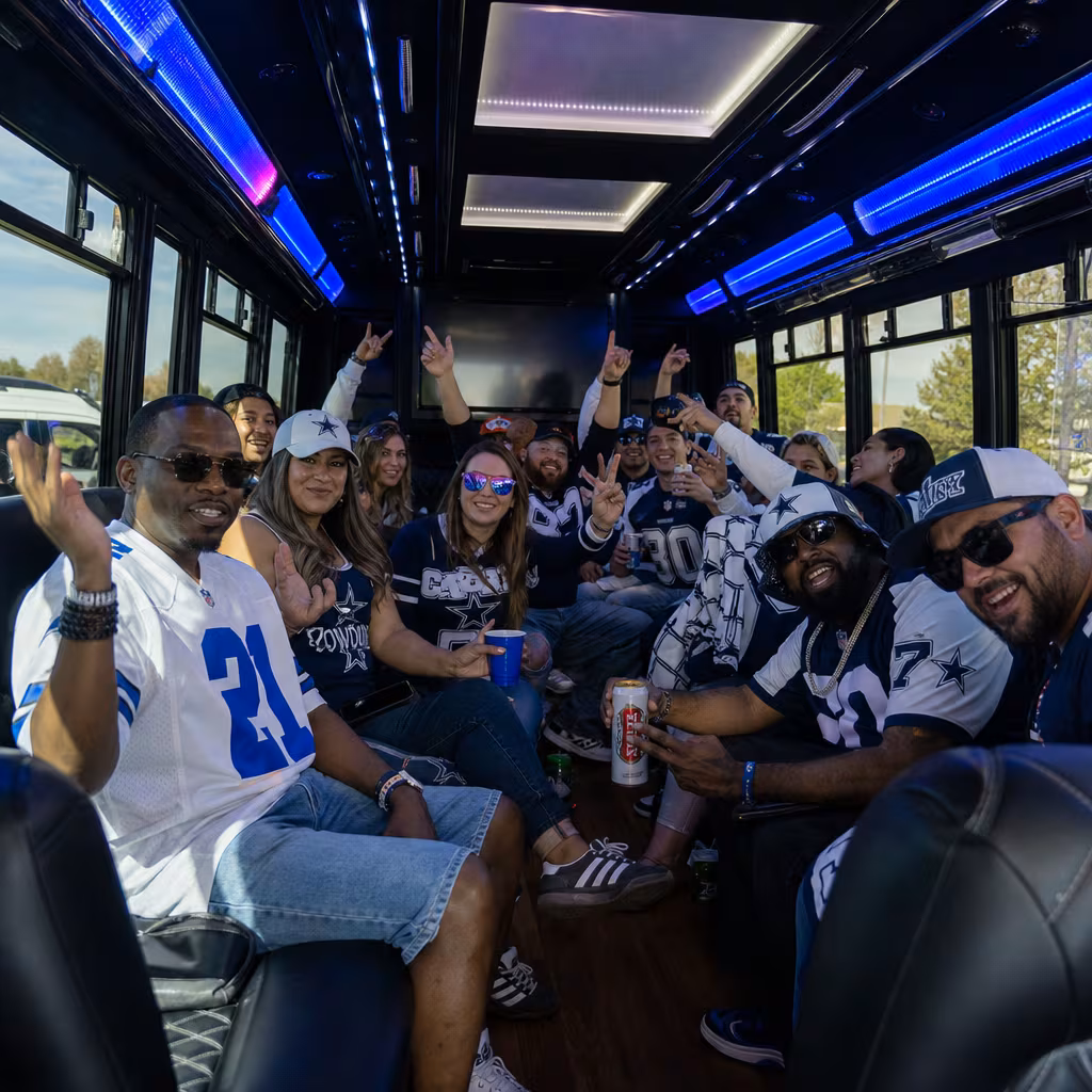 Group boarding a white charter bus for Sporting Event Transportation transportation in Dallas