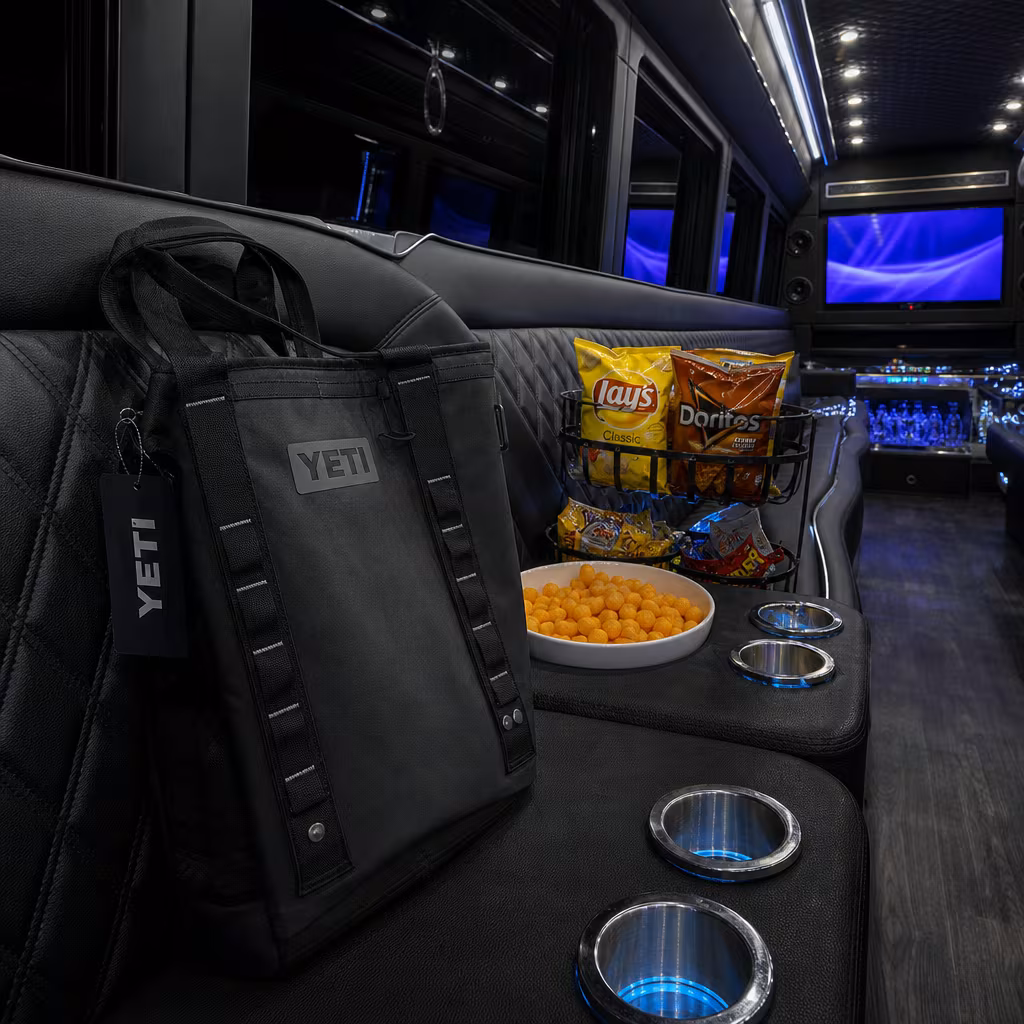 Party bus interior with wraparound leather seating and LED lighting in Dallas
